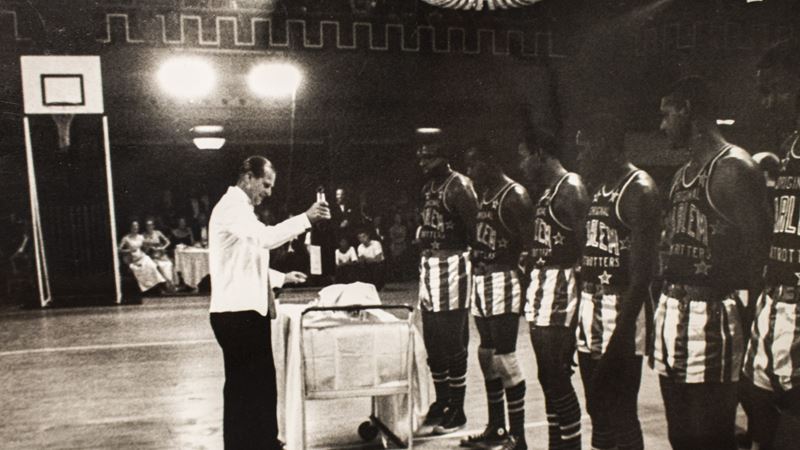 Our Patron and Twelfth Man serves the drinks to the Globetrotters.jpg